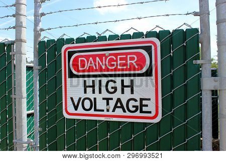 Sign Communicating Danger High Voltage Equipment Is Behind Gate