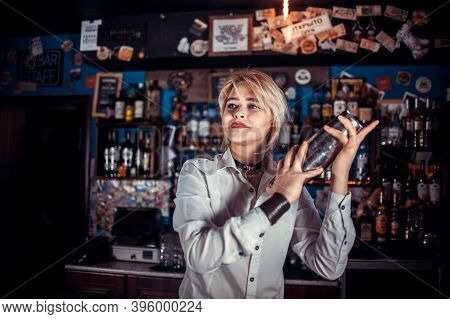 Girl Bartender Makes A Cocktail In The Brasserie