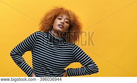 Beutiful Young African American Black Woman Model With Curly Hair In Striped Blouse Posing Over Yell