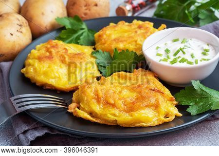 Fried Cakes Of Grated Potatoes On The Plate With Sauce. Traditional Pancakes Boxty Raggmunk.