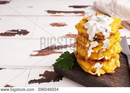 Fried Cakes Of Grated Potatoes On The Plate With Sauce. Traditional Pancakes Boxty Raggmunk.