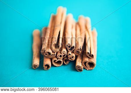 Cinnamon Sticks On The Turquois Background With Copy Space For Your Text
