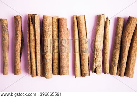 Cinnamon Sticks On The Pink Background, Close Up