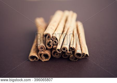Cinnamon Sticks On The Dark Brown, Chocolate Background