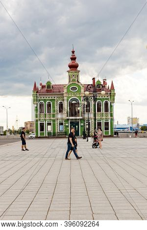 Yoshkar-ola, Mari El, Russia 30 July 2020: Arkhangelskaya Sloboda Quay Bruges Beautiful Green House 