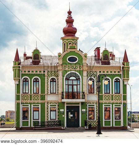 Yoshkar-ola, Mari El, Russia 30 July 2020: Arkhangelskaya Sloboda Quay Bruges Beautiful Green House 