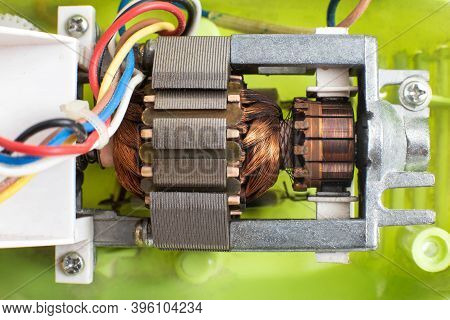 Broken Electric Motor In A Household Appliance Hand Mixer. Malfunction Of The Rotor And Stator Of El