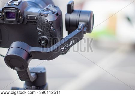 Ronin Stabilizer And Camera Overlooking A Blurry Street