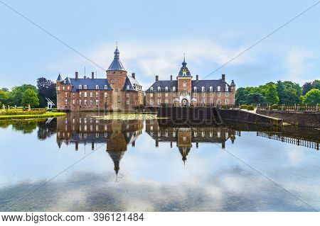 Anholt, Germany - August 14, 2014: Famous Anholt Castle In Germany With Reflection In Water