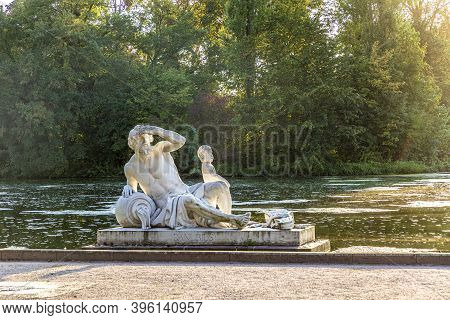Schwetzingen, Germany - September 11, 2020: Famous River God Rhenus In  Beautiful Schwetzingen Park,
