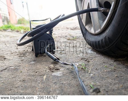 Pump Up The Autowheel Compressor On The Road. Car Electro Pump.