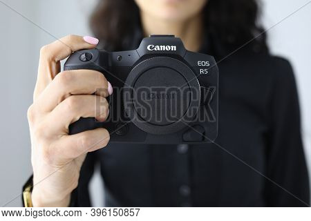 Minsk, Belarus - November 19 2020 : Woman Hold Canon Eos R5 In Hand Closeup. Illustrative Editorial.