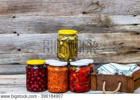Jars With Variety Of Canned Vegetables And Fruits, Jars With Zacusca. Preserved Food Concept In A Ru