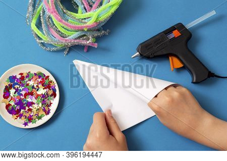 Child Makes Christmas Tree From Chenille Wire. Original Art Project For Children. Diy Concept. Step 