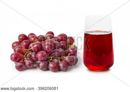 Ripe grapes and glass of fruit juice isolated on white background