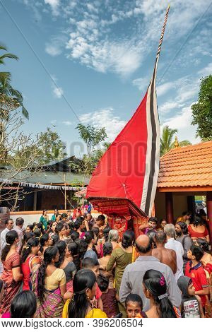 Payyanur, India - December 5, 2019: Theyyam artist perform during temple festival in Payyanur, Kerala, India. Theyyam is a popular ritual form of worship in Kerala, India
