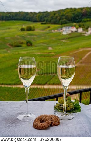 Tasting Of French Sparkling White Wine With Bubbles Champagne On Outdoor Terrace With View On Grand