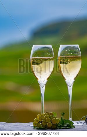 Tasting Of French Sparkling White Wine With Bubbles Champagne On Outdoor Terrace With View On Grand
