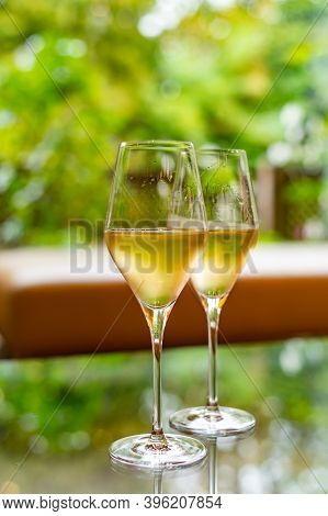 Tasting Of French Sparkling White Wine With Bubbles Champagne On Outdoor Terrace In France