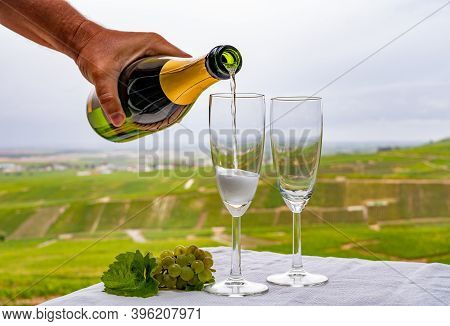 Tasting Of French Sparkling White Wine With Bubbles Champagne On Outdoor Terrace With View On Grand