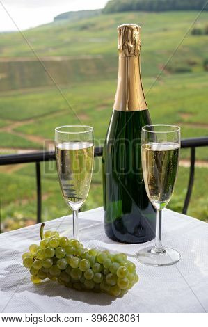 Tasting Of French Sparkling White Wine With Bubbles Champagne On Outdoor Terrace With View On Grand