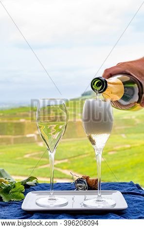 Tasting Of French Sparkling White Wine With Bubbles Champagne On Outdoor Terrace With View On Grand