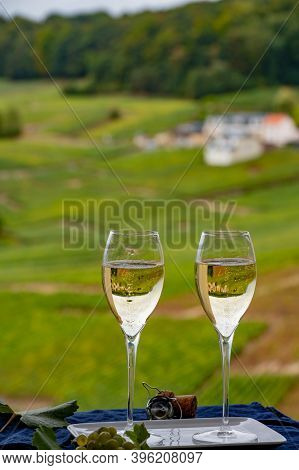 Tasting Of French Sparkling White Wine With Bubbles Champagne On Outdoor Terrace With View On Grand