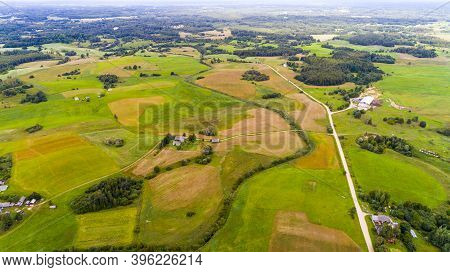 Flying Over The Farmland With Cultivated Fields
