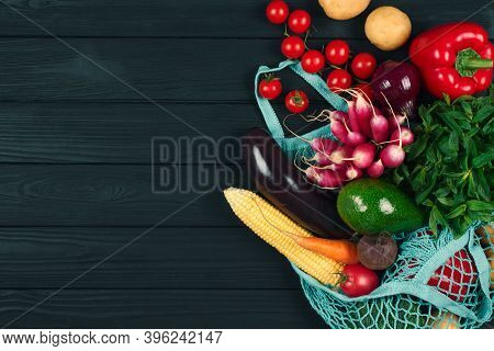 Cotton Bag Full Of Fresh Farm Raw Vegetables From Local Farmer Market, On Black Wooden Background Or