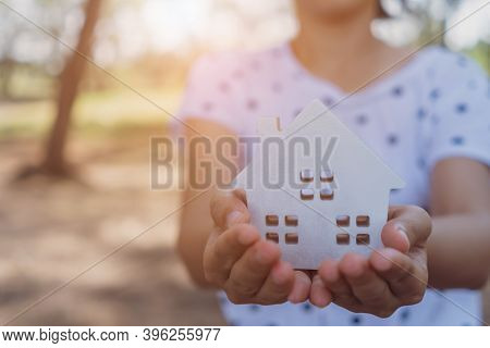 Copyspace Model Of A Little House That Woman Holds It Background. Deam Life Have Own House Property 