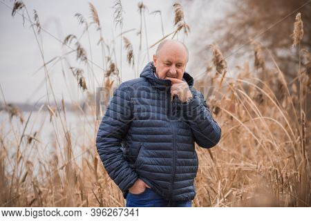 Senior Man In Grief And Sorrow. The Concept Of A Depressed Older Man, The Non-acceptance Of Oneself 