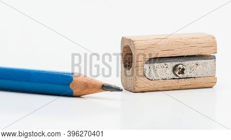 Wooden pencil sharpener with blue pencil