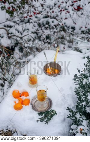 Mulled Wine With Sea Buckthorn And Mandrins In The Winter Garden Selective Focus