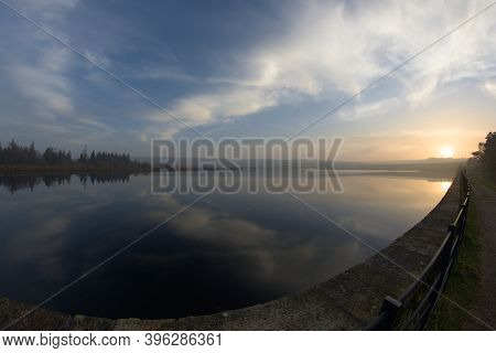 Middle Reservoir At Redmires Reservoirs Near Sheffield, Flat Calm At Sunset. Fish Eye Perspective As