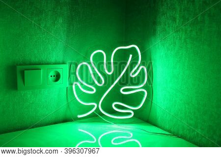 Neon Sign Monstera In The Decor Of The Bedroom. Trendy Style. Neon Sign. Custom Neon. Home Decor.