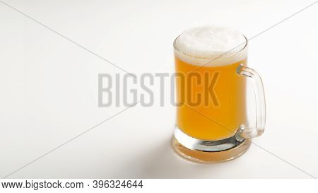 Most Popular Delicious Drink, Evening In Pub And Beer Advertisement. Cold Glass Mug Of Fresh Light C
