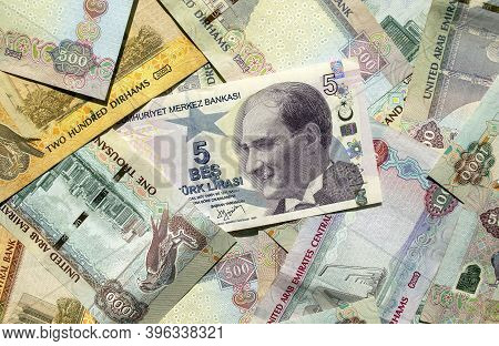 Turkish Lira On Top Of Uae National Currency, Top View Of Mixed Dirhams Banknotes. Aed And Try Money