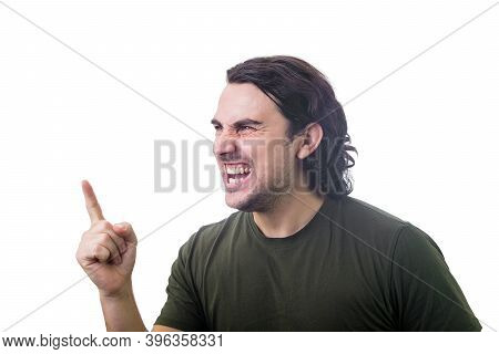 Angry Young Man Reacting Furious Clenching Teeth Screaming And Shaking His Index Finger. Irritated A