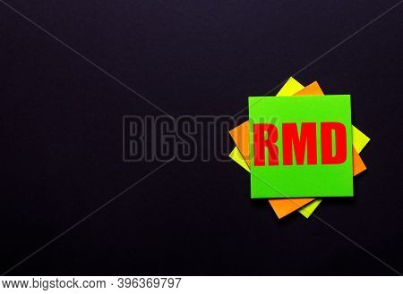 The Word Rmd On A Bright Sticker On A Dark Background