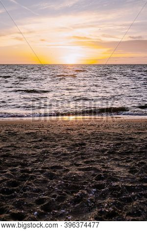 Urk Lighthouse With Old Harbor During Sunset, Urk Is A Small Village By The Lake Ijsselmeer In The N