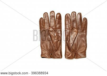 Brown Classic Leather Mens Gloves On White Isolated Background Top View. Stylish Fashionable Winter 