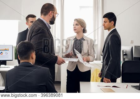 The Chief Of The Construction Company Holds A Standing Meeting With Subordinates, Gives Instructions