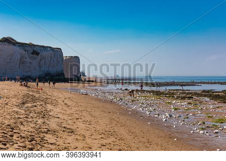 MARGATE, Kent, UK: 21 May 2020: Visitors to Margate's Main Sands beach surrounded by white cliffs during the heatwave in Britain.