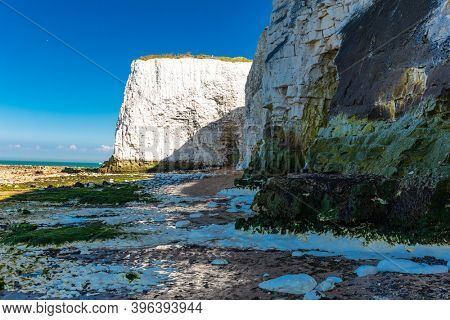 MARGATE, Kent, UK: 21 May 2020: Visitors to Margate's Main Sands beach surrounded by white cliffs during the heatwave in Britain.
