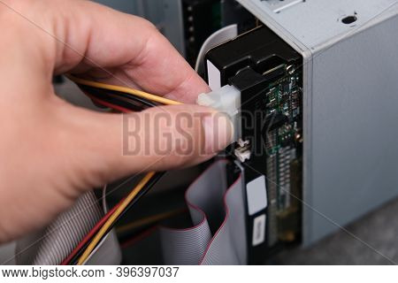 Moscow, Russia - September 08, 2020: Hands Of A Technician Pluging The Cable While Computer Rapair A