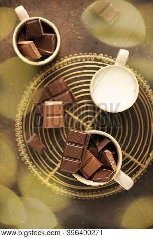 Concept Of Winter Holiday. Piecies Of Chocolate And Milk Ready To Prerare Hot Chocolate Drink.