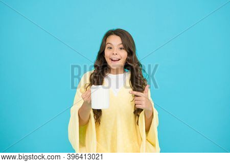 Starting Day With Breakfast. Small Kid Turquoise Background. Little Girl Drink Cocoa Or Milk Before 