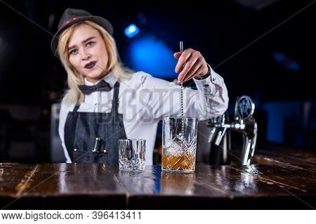 Girl Barman Concocts A Cocktail In The Pothouse