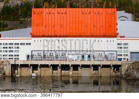 The Main Building Of The Kolyma Hydroelectric Power Station On The Kolyma River.