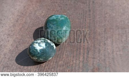 Moss Agates, Polished Tumbled Stones. Green Colour Stones With Patches Of White In Between Form Of S